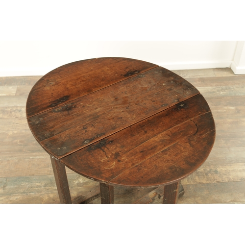 1324 - A 17TH CENTURY WALNUT GATE LEG TABLE OF SMALL SIZE with drop-down sides and joined base with hinged ... 