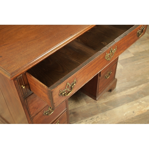 1325 - AN UNUSUAL GEORGE III MAHOGANY KNEEHOLE DESK having a drop-down top with graduated drawers fitted wi... 