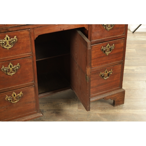 1325 - AN UNUSUAL GEORGE III MAHOGANY KNEEHOLE DESK having a drop-down top with graduated drawers fitted wi... 