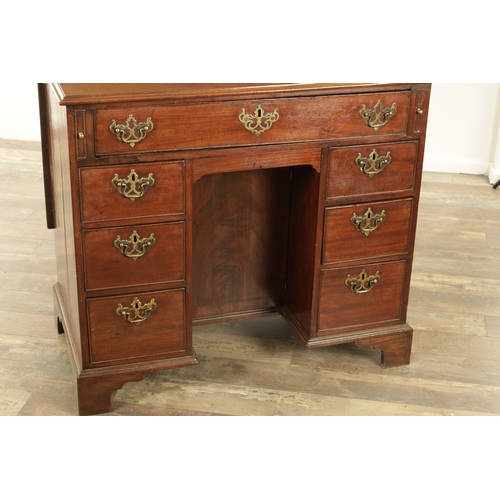 1325 - AN UNUSUAL GEORGE III MAHOGANY KNEEHOLE DESK having a drop-down top with graduated drawers fitted wi... 