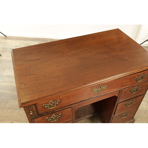 1325 - AN UNUSUAL GEORGE III MAHOGANY KNEEHOLE DESK having a drop-down top with graduated drawers fitted wi... 