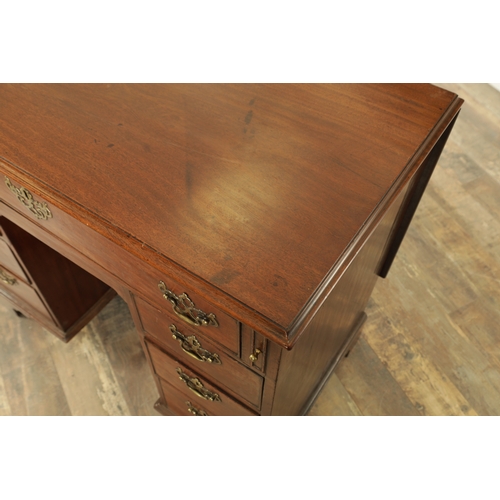 1325 - AN UNUSUAL GEORGE III MAHOGANY KNEEHOLE DESK having a drop-down top with graduated drawers fitted wi... 