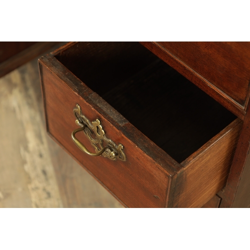 1325 - AN UNUSUAL GEORGE III MAHOGANY KNEEHOLE DESK having a drop-down top with graduated drawers fitted wi... 