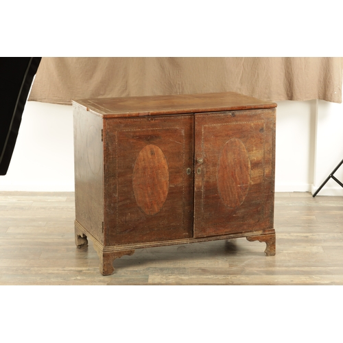 1330 - A GEORGE III INLAID MAHOGANY COMMODE with satinwood oval panels to the top and hinged doors raised o... 