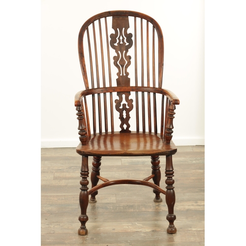 1331 - AN EARLY 19TH CENTURY NOTTINGHAMSHIRE YEW WOOD HIGH BACK WINDSOR CHAIR with hooped back and shaped p... 