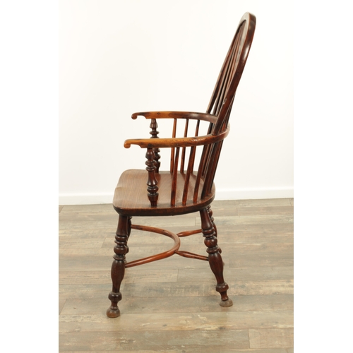 1331 - AN EARLY 19TH CENTURY NOTTINGHAMSHIRE YEW WOOD HIGH BACK WINDSOR CHAIR with hooped back and shaped p... 