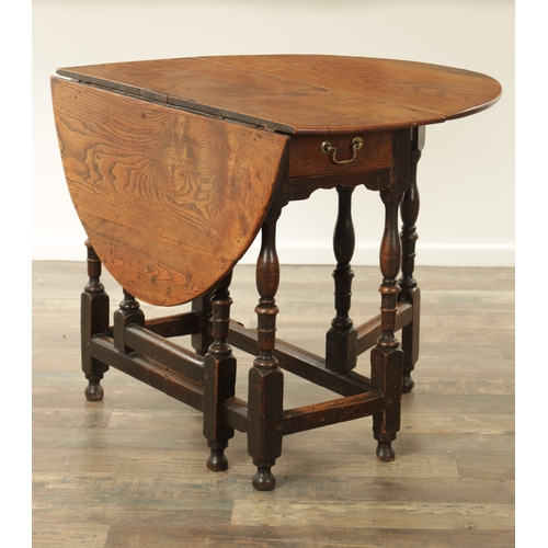 1334 - AN EARLY 18TH CENTURY JOINED ELM AND OAK GATELEG TABLE the richly figured oval drop leaf top above a... 