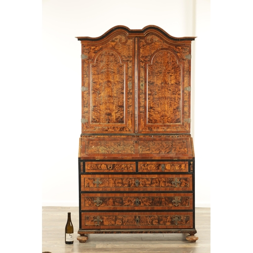 1335 - AN EARLY 18TH CENTURY CONTINENTAL MULBERRY WOOD BUREAU BOOKCASE with a shaped top surmount and hinge... 