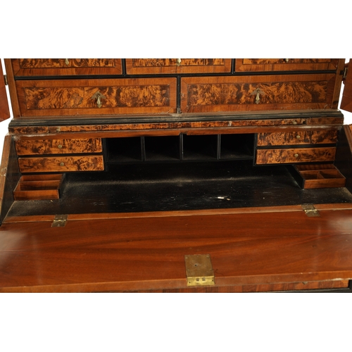 1335 - AN EARLY 18TH CENTURY CONTINENTAL MULBERRY WOOD BUREAU BOOKCASE with a shaped top surmount and hinge... 