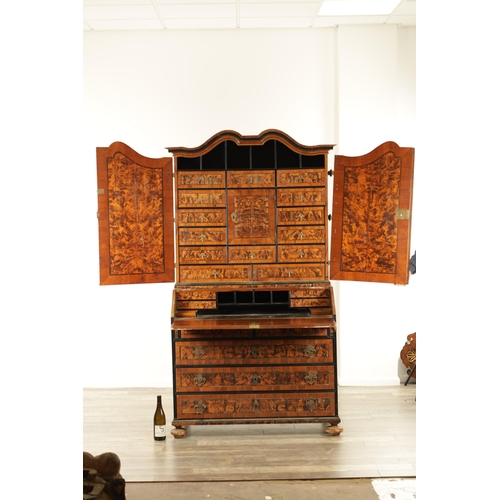 1335 - AN EARLY 18TH CENTURY CONTINENTAL MULBERRY WOOD BUREAU BOOKCASE with a shaped top surmount and hinge... 