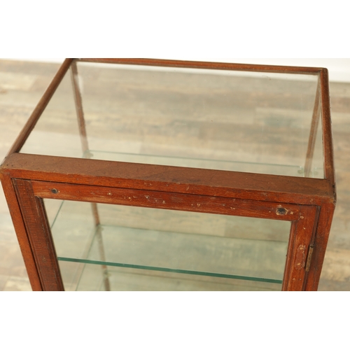 1338 - A LATE 19TH CENTURY FREESTANDING MAHOGANY GLAZED DISPLAY CASE with rear door and plate glass shelves... 