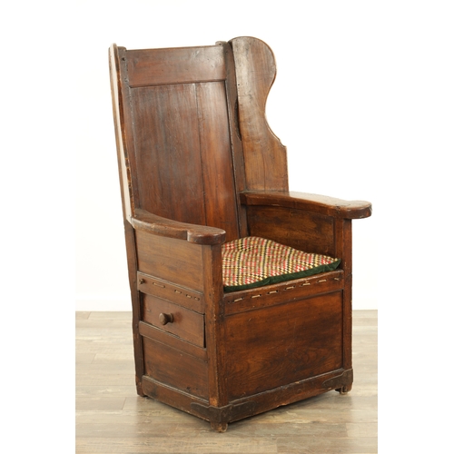 1341 - A MID 18TH CENTURY FRUITWOOD AND PINE LAMBING CHAIR with panelled winged back above a rope seat and ... 