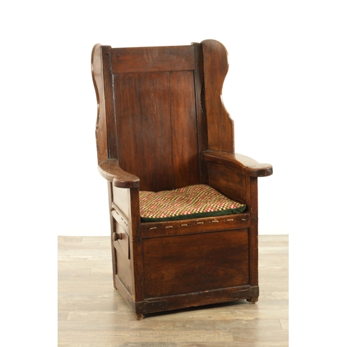 1341 - A MID 18TH CENTURY FRUITWOOD AND PINE LAMBING CHAIR with panelled winged back above a rope seat and ... 