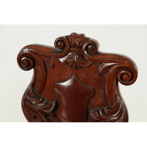 1346 - A PAIR OF WILLIAM IV MAHOGANY HALL CHAIRS with leaf-carved shaped backs above rounded seats; raised ... 