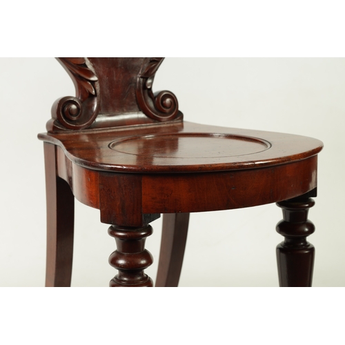 1346 - A PAIR OF WILLIAM IV MAHOGANY HALL CHAIRS with leaf-carved shaped backs above rounded seats; raised ... 