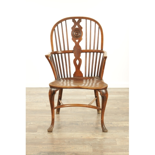 1347 - A 19TH CENTURY ASH AND ELM CABRIOLE LEGGED WINDSOR CHAIR with hooped back and shaped back splat with... 