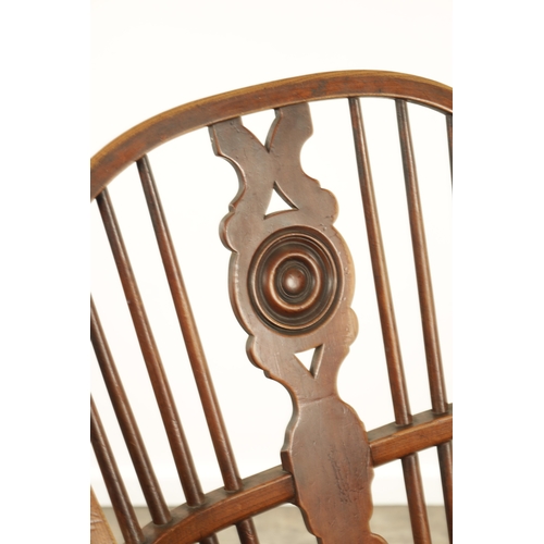 1347 - A 19TH CENTURY ASH AND ELM CABRIOLE LEGGED WINDSOR CHAIR with hooped back and shaped back splat with... 