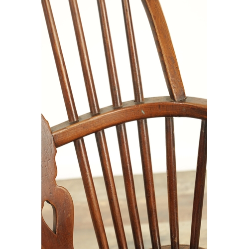 1347 - A 19TH CENTURY ASH AND ELM CABRIOLE LEGGED WINDSOR CHAIR with hooped back and shaped back splat with... 