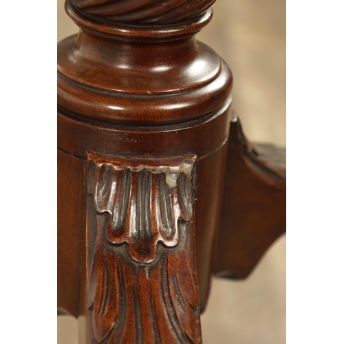 1349 - A GEORGE III MAHOGANY SERPENTINE TILT TOP TABLE with tapering fluted stem above a shaped carved cabr... 