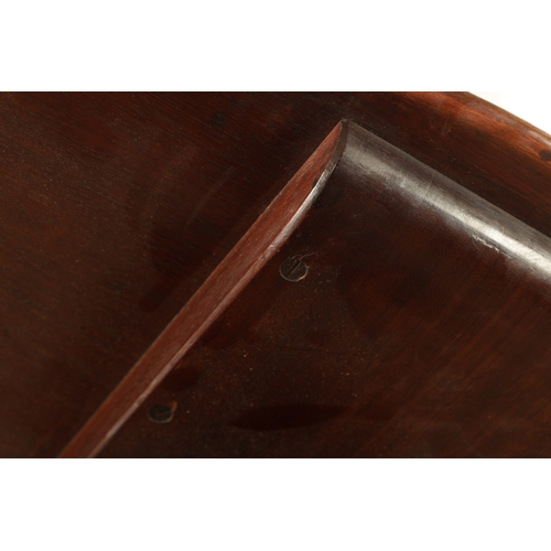 1349 - A GEORGE III MAHOGANY SERPENTINE TILT TOP TABLE with tapering fluted stem above a shaped carved cabr... 