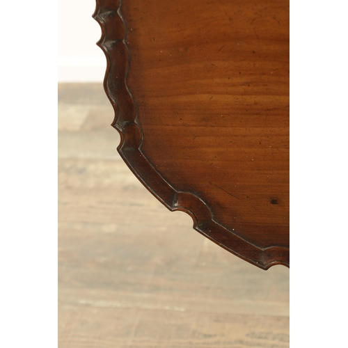 1352 - A GEORGE III MAHOGANY TILT-TOP TABLE with pie crust top above a tapering ring-turned stem and shaped... 