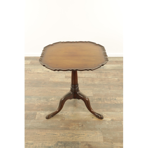 1352 - A GEORGE III MAHOGANY TILT-TOP TABLE with pie crust top above a tapering ring-turned stem and shaped... 