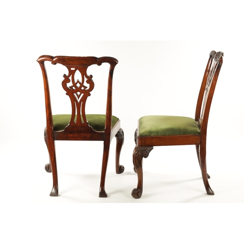 1354 - A GOOD PAIR OF MID 18TH CENTURY WALNUT SIDE CHAIRS the elaborate shaped carved top rails above scrol... 