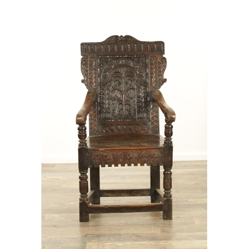 1356 - A GOOD LATE 17TH CENTURY JOINED OAK WAINSCOT CHAIR with scrolled leaf-carved crest and matching ears... 