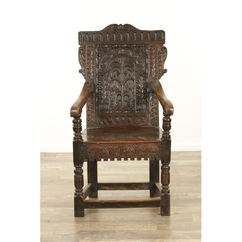 1356 - A GOOD LATE 17TH CENTURY JOINED OAK WAINSCOT CHAIR with scrolled leaf-carved crest and matching ears... 