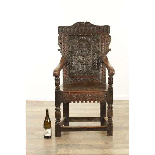 1356 - A GOOD LATE 17TH CENTURY JOINED OAK WAINSCOT CHAIR with scrolled leaf-carved crest and matching ears... 