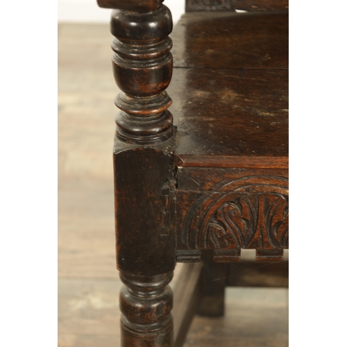 1356 - A GOOD LATE 17TH CENTURY JOINED OAK WAINSCOT CHAIR with scrolled leaf-carved crest and matching ears... 