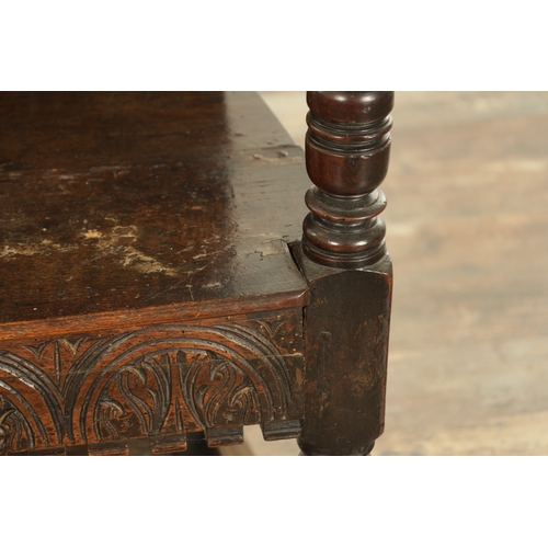 1356 - A GOOD LATE 17TH CENTURY JOINED OAK WAINSCOT CHAIR with scrolled leaf-carved crest and matching ears... 