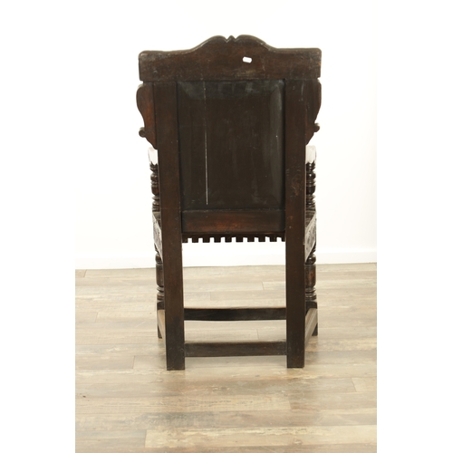 1356 - A GOOD LATE 17TH CENTURY JOINED OAK WAINSCOT CHAIR with scrolled leaf-carved crest and matching ears... 