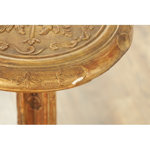 1363 - A DECORATIVE GILT GESSO GOTHIC STYLE OCCASIONAL TABLE with leaf-carved decoration raised on a tripod... 