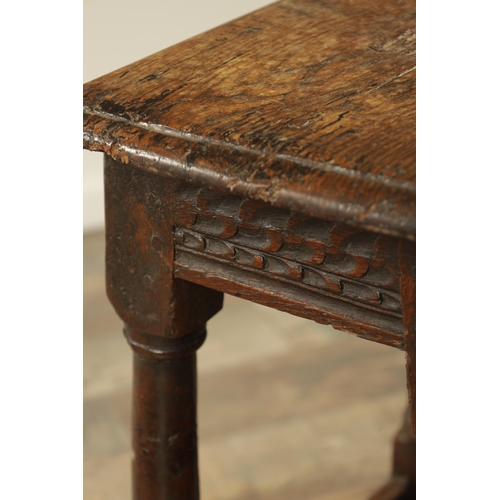 1364 - A LATE 17TH CENTURY JOINED OAK JOINT STOOL with plank top above a ring turned base joined by stretch... 