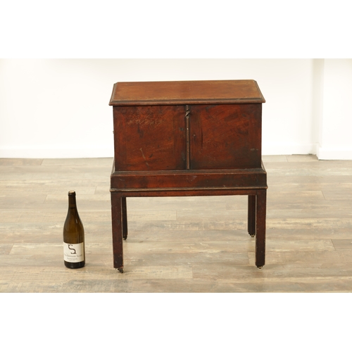 1366 - A GEORGE III MAHOGANY CELLARETTE ON STAND with hinged top and side carrying handles; raised on squar... 