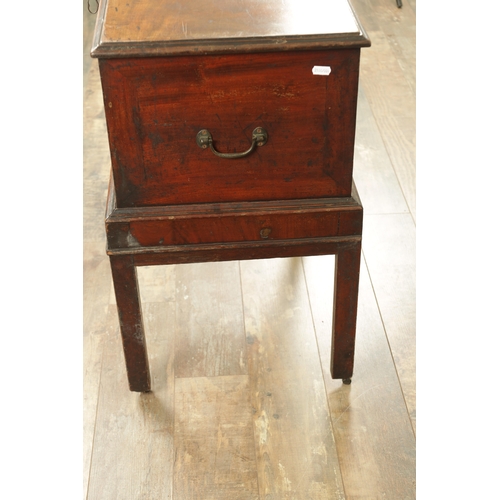 1366 - A GEORGE III MAHOGANY CELLARETTE ON STAND with hinged top and side carrying handles; raised on squar... 