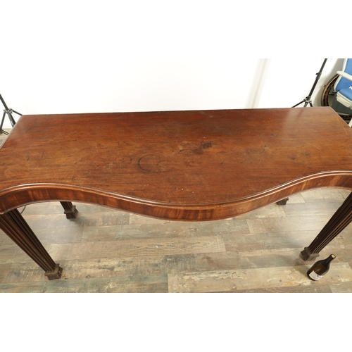 1367 - A GEORGE III SERPENTINE SHAPED SERVING TABLE with shallow frieze and tapering reeded legs with angle... 