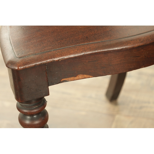 1368 - A PAIR OF 19TH CENTURY MAHOGANY HALL CHAIRS with leaf-carved shaped backs and raised on ring turned ... 