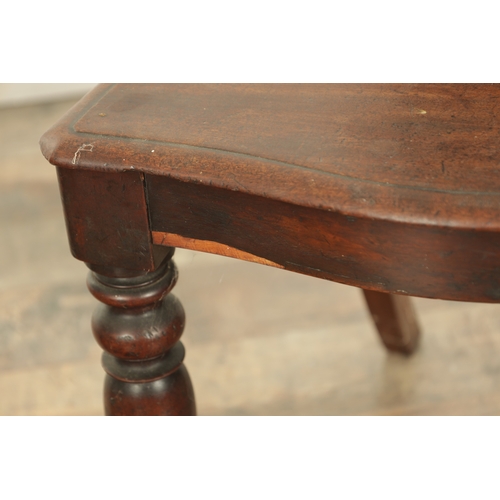 1368 - A PAIR OF 19TH CENTURY MAHOGANY HALL CHAIRS with leaf-carved shaped backs and raised on ring turned ... 