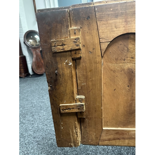 1374 - AN 18TH CENTURY WALNUT MALTESE COMMODE with two frieze drawers above fielded hinged cupboard doors r... 