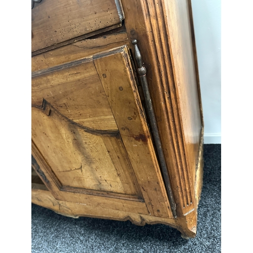 1374 - AN 18TH CENTURY WALNUT MALTESE COMMODE with two frieze drawers above fielded hinged cupboard doors r... 