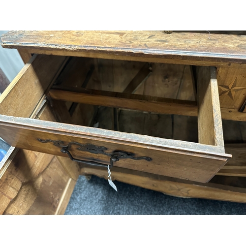 1374 - AN 18TH CENTURY WALNUT MALTESE COMMODE with two frieze drawers above fielded hinged cupboard doors r... 