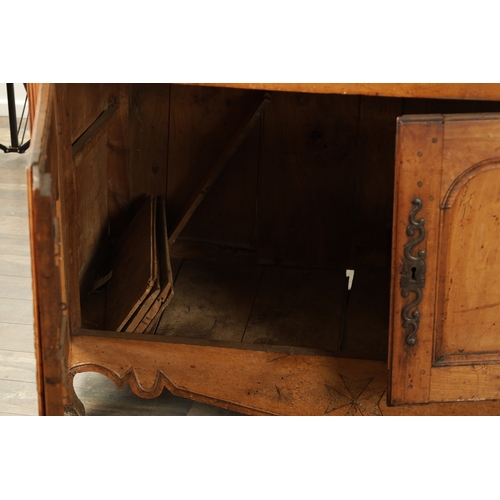 1374 - AN 18TH CENTURY WALNUT MALTESE COMMODE with two frieze drawers above fielded hinged cupboard doors r... 