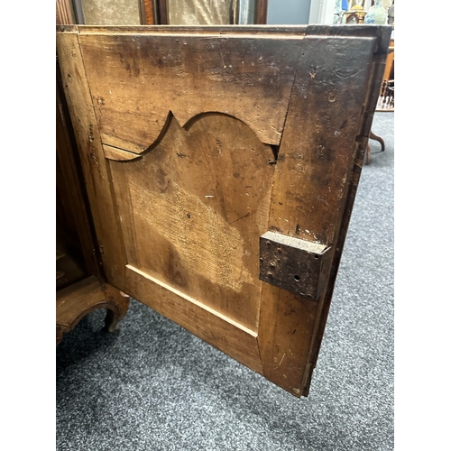 1374 - AN 18TH CENTURY WALNUT MALTESE COMMODE with two frieze drawers above fielded hinged cupboard doors r... 