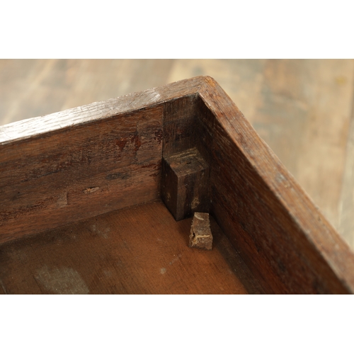 1379 - AN 18TH CENTURY OAK CLOSE STOOL with a hinged top above tapering turned legs with pad feet (42cm squ... 