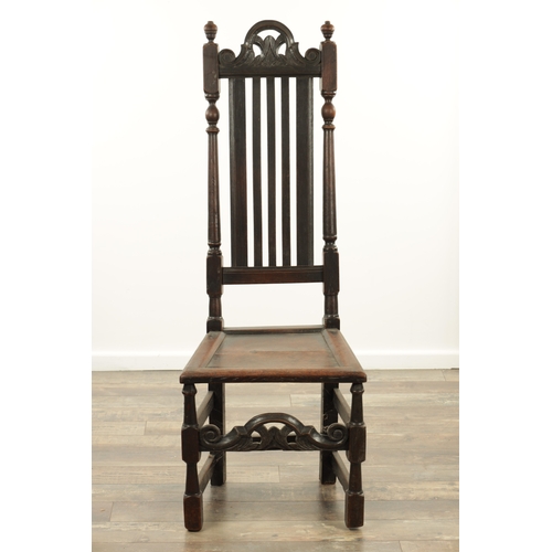 1383 - A CHARLES II OAK HALL CHAIR with a raised slatted back and panelled seat above turned legs and carve... 