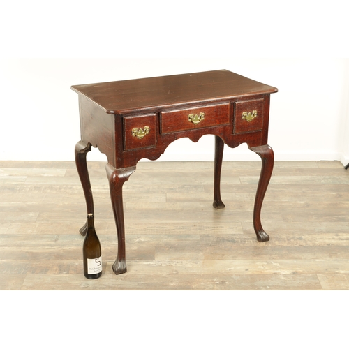 1393 - A GEORGE II OAK LOWBOY with moulded edge top fitted pullout candle side to one side above three frie... 