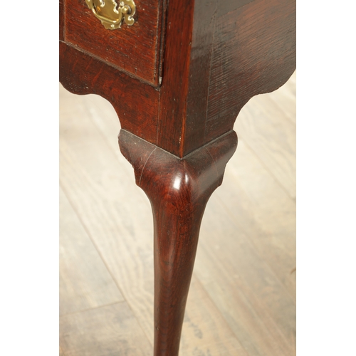 1393 - A GEORGE II OAK LOWBOY with moulded edge top fitted pullout candle side to one side above three frie... 