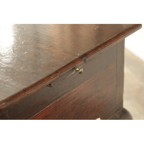 1393 - A GEORGE II OAK LOWBOY with moulded edge top fitted pullout candle side to one side above three frie... 